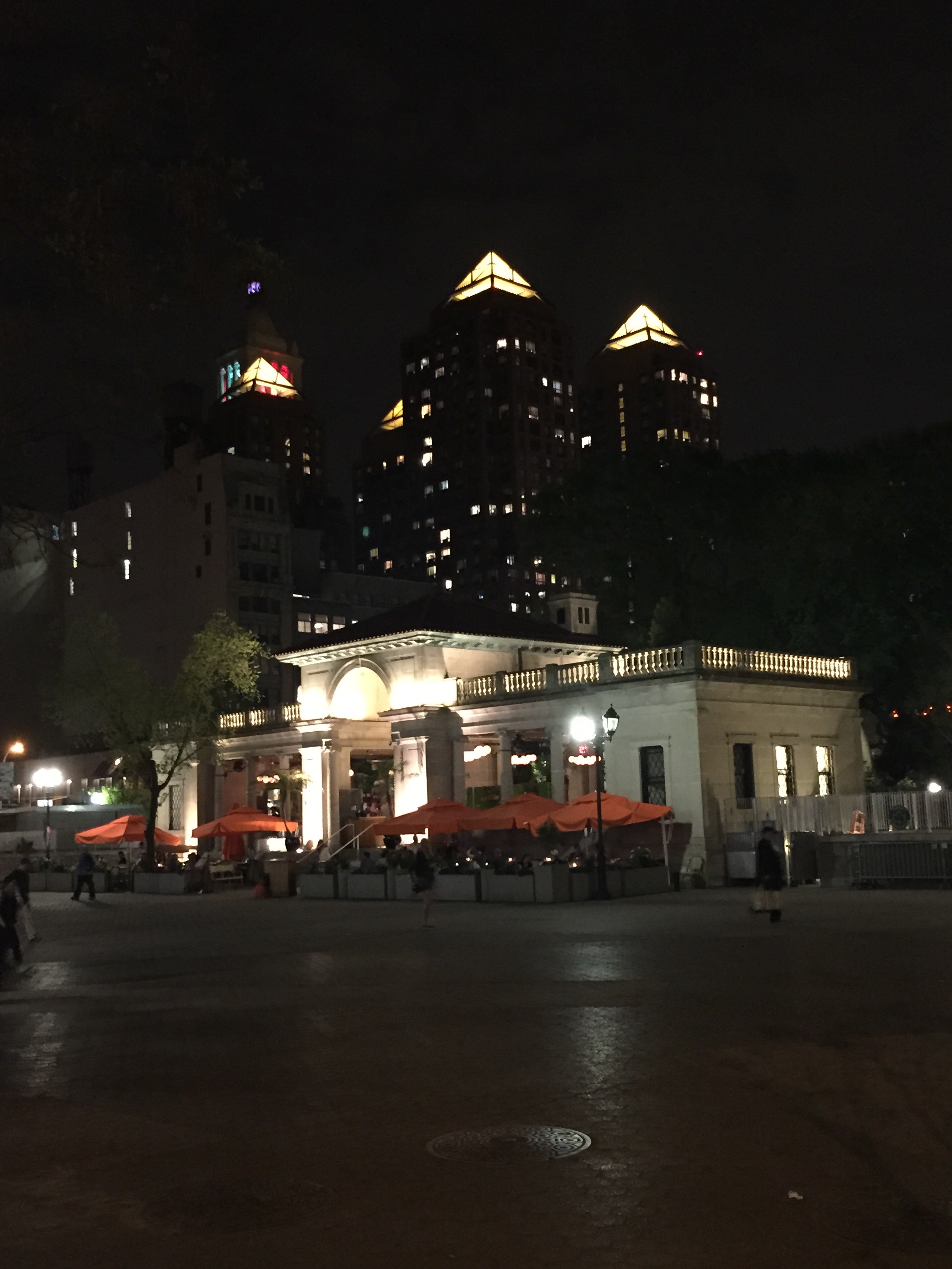 A night photo with the Union Square Pavilion with the Zeckendorf Towers in the background